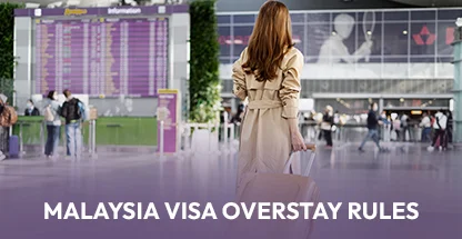 Female traveler with suitcase at airport terminal learning about Malaysia visa overstay rules